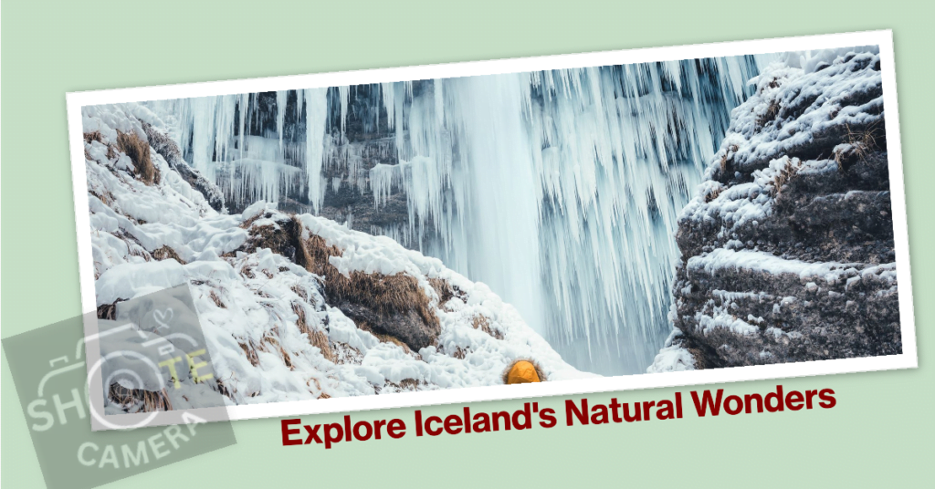 Top Travel Destinations for Photography Enthusiasts 3 A postcard featuring a close-up photograph of a waterfall in Iceland. The waterfall cascades over rugged, icy rocks with patches of snow. In the foreground, there’s a single orange leaf on a rock, contrasting with the predominantly white and blue hues of the scene. The bottom of the image has a caption in bold letters that reads ‘Explore Iceland’s Natural Wonders.’ The postcard is angled against a light background with two corners seemingly folded over, giving it a three-dimensional appearance